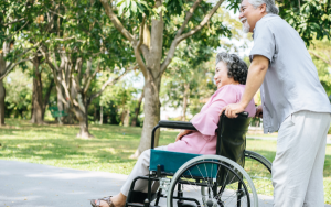 couple one pushing wheelchair